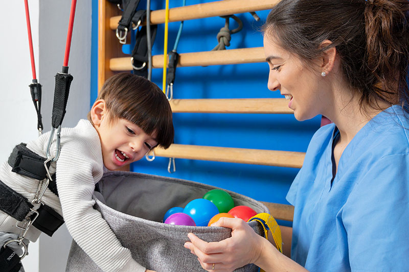 Disabled child is playing, learning and exercising in rehabilitation therapy hospital, Lifestyle of a child with disability. Happy disability kid concept .
